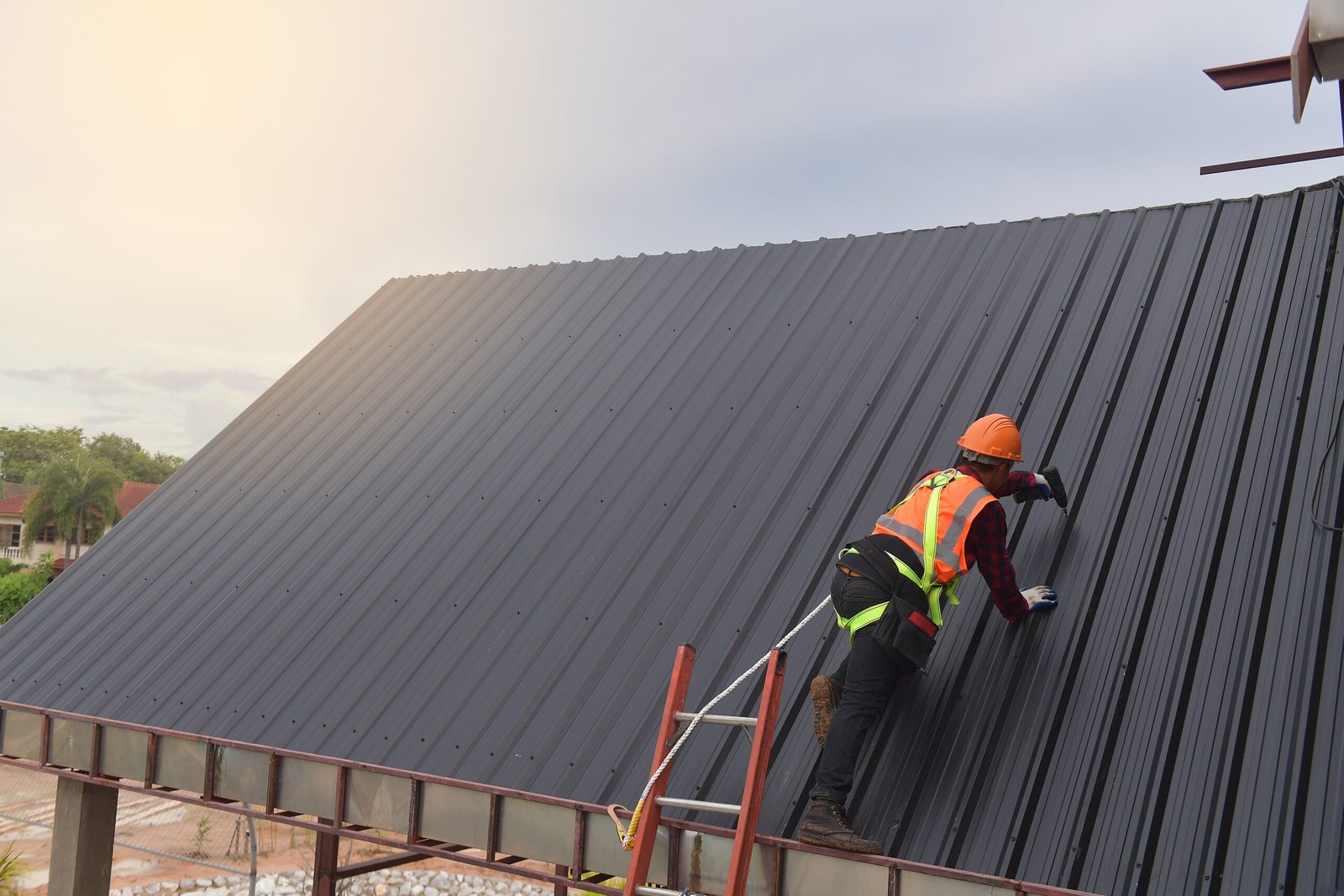 Commercial roofer working safely in Clapham